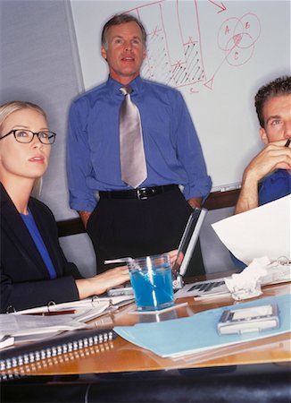 simsearch:700-00183909,k - Businessman Standing in Front of White Board During Meeting Foto de stock - Con derechos protegidos, Código: 700-00050936