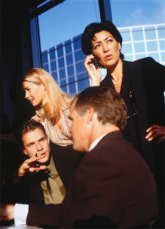 simsearch:695-03381633,k - Business People in Meeting and Woman Using Cell Phone Stock Photo - Rights-Managed, Code: 700-00050952