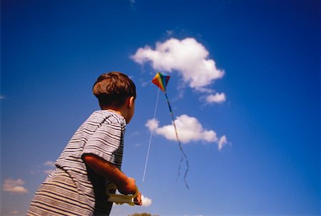 Back View of Boy Flying Kite Stock Photo - Rights-Managed, Code: 700-00051160