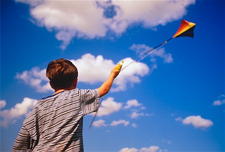 Back View of Boy Flying Kite Stock Photo - Rights-Managed, Code: 700-00051161