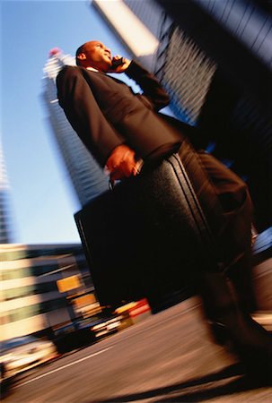 simsearch:700-00049474,k - Businessman Using Cell Phone Crossing Street Stock Photo - Rights-Managed, Code: 700-00051478
