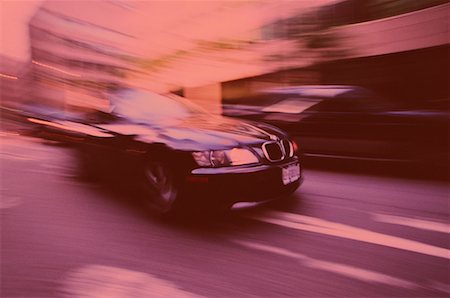 Black Car Speeding on Street Toronto, Ontario, Canada Stock Photo - Rights-Managed, Code: 700-00051569