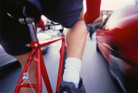riding bike blur city - Back View of Cyclist in Traffic Stock Photo - Rights-Managed, Code: 700-00052045