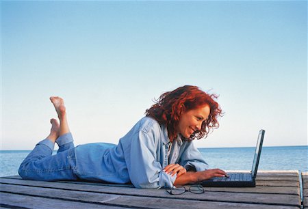 simsearch:700-00053497,k - Woman Lying on Dock Using Laptop Computer Stock Photo - Rights-Managed, Code: 700-00052595