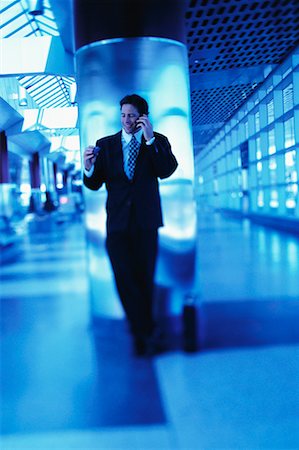 simsearch:700-00027893,k - Businessman Leaning on Pillar Using Cell Phone and Pager Foto de stock - Con derechos protegidos, Código: 700-00053053