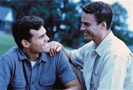 Male Couple Talking in Park Stock Photo - Rights-Managed, Code: 700-00053216