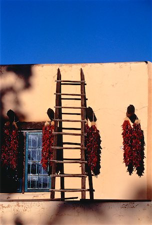 Chili Peppers Hanging from Pegs On Wall near Ladder New Mexico, USA Stock Photo - Rights-Managed, Code: 700-00053330