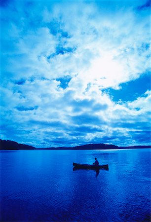 simsearch:700-00091945,k - Man in Canoe with Cloudy Sky Stock Photo - Rights-Managed, Code: 700-00053382