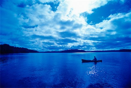 simsearch:700-00091945,k - Man in Canoe with Cloudy Sky Stock Photo - Rights-Managed, Code: 700-00053383
