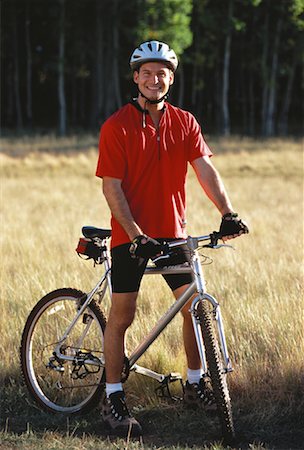 simsearch:700-00053390,k - Portrait of Man on Mountain Bike In Field of Tall Grass Foto de stock - Con derechos protegidos, Código: 700-00053471