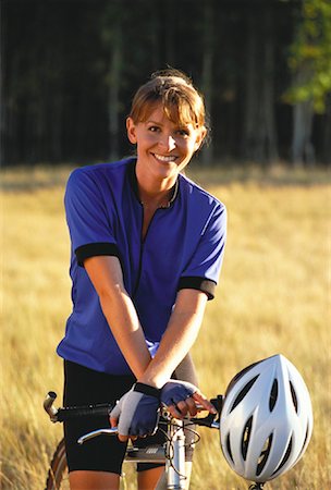 simsearch:700-00053390,k - Portrait of Woman on Mountain Bike in Field of Tall Grass Foto de stock - Con derechos protegidos, Código: 700-00053473