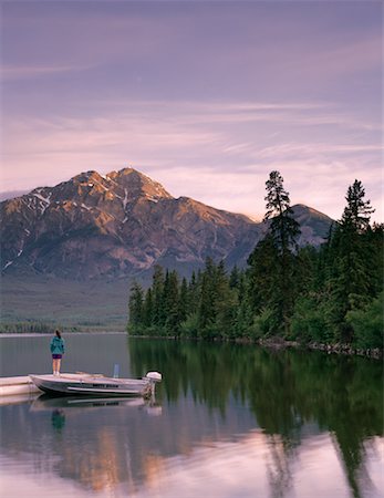 secluded lake woman - Woman Standing on Dock near Boat Pyramid Lake, Alberta, Canada Stock Photo - Rights-Managed, Code: 700-00053667