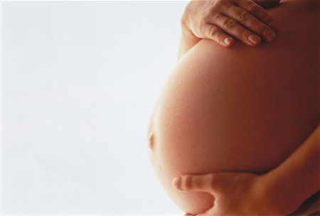 simsearch:700-00528067,k - Gros plan du ventre de la femme enceinte Photographie de stock - Rights-Managed, Code: 700-00053866