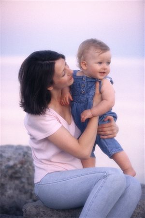 simsearch:700-00518639,k - Mother and Baby Sitting on Rock Near Water Stock Photo - Rights-Managed, Code: 700-00064219