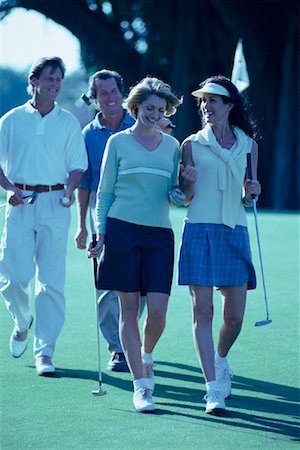 Group of People Walking on Golf Course Stock Photo - Rights-Managed, Code: 700-00064238