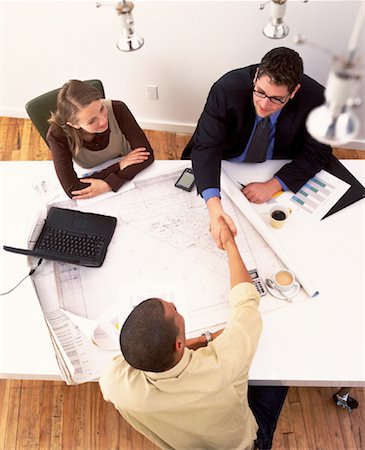 simsearch:700-00027498,k - Overhead View of Business People In Meeting, Shaking Hands Foto de stock - Con derechos protegidos, Código: 700-00064279