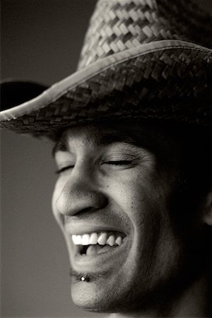 fashions cowboys for male - Close-Up of Man Wearing Hat Laughing Stock Photo - Rights-Managed, Code: 700-00064402