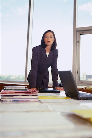 simsearch:700-01344854,k - Portrait of Businesswoman Standing at Desk Foto de stock - Con derechos protegidos, Código: 700-00064442