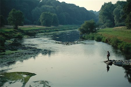 Man Fly Fishing from Rocks River Nore, Ireland Stock Photo - Rights-Managed, Code: 700-00064457