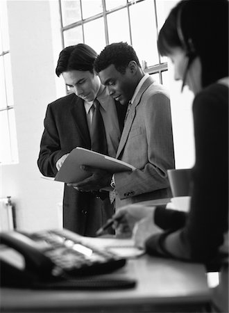 Two Businessmen Reading File In Office Stock Photo - Rights-Managed, Code: 700-00064541