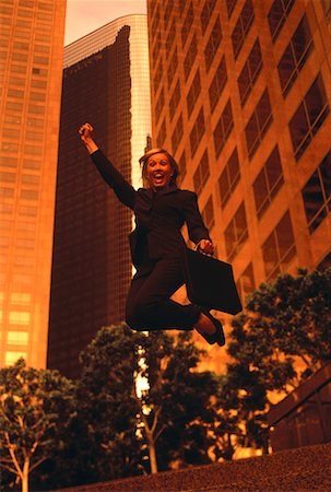 simsearch:700-00039942,k - Ecstatic Businesswoman Jumping In Air Stock Photo - Rights-Managed, Code: 700-00064555