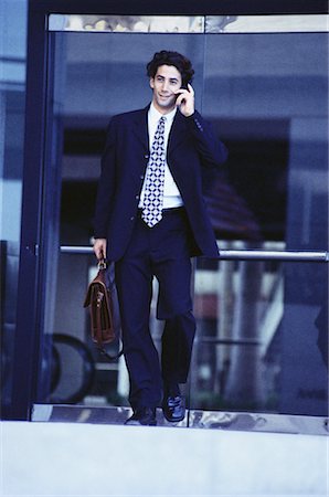 simsearch:700-00043555,k - Businessman Carrying Briefcase Using Cell Phone Stock Photo - Rights-Managed, Code: 700-00064791