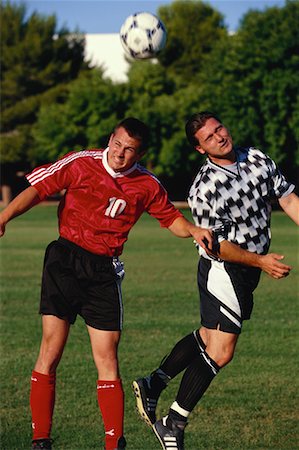 simsearch:700-00041227,k - Two Men Playing Soccer Outdoors Stock Photo - Rights-Managed, Code: 700-00065664