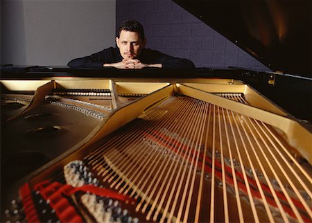 Portrait of Man Leaning on Piano Stock Photo - Rights-Managed, Code: 700-00065666