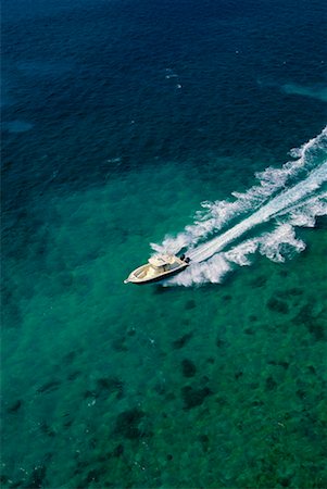 Aerial View of Boat Speeding On Water, Abaco, Bahamas Stock Photo - Rights-Managed, Code: 700-00065679