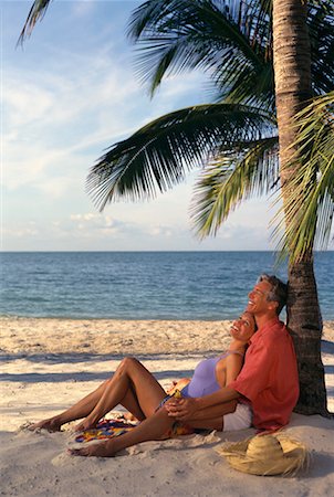 Mature Couple Relaxing on Beach Stock Photo - Rights-Managed, Code: 700-00066174