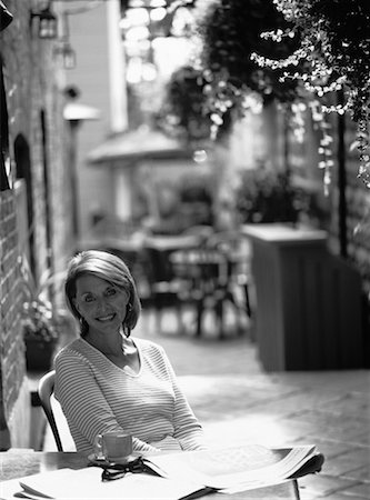 Portrait of Mature Woman Sitting At Table Outdoors Stock Photo - Rights-Managed, Code: 700-00066488