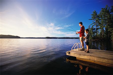 father and son fishing dock lake - Father and Son Fishing from Dock Stock Photo - Rights-Managed, Code: 700-00066525