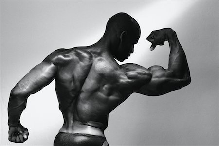 simsearch:700-01043674,k - Back of Male Body Builder Flexing Muscles Stock Photo - Rights-Managed, Code: 700-00066635