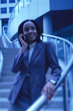 simsearch:700-00071171,k - Businesswoman Standing on Steps Using Cell Phone Stock Photo - Rights-Managed, Code: 700-00066645
