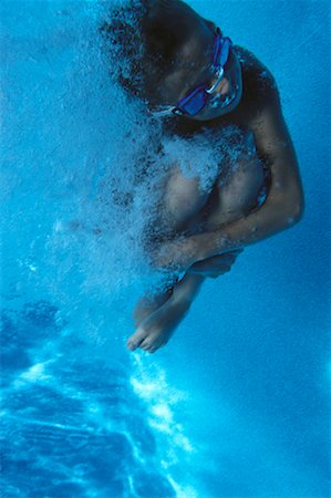 simsearch:700-00066429,k - Underwater View of Boy Jumping Into Swimming Pool Foto de stock - Con derechos protegidos, Código: 700-00066664