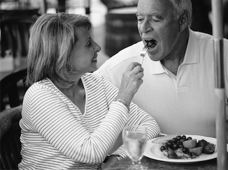 Mature Couple Eating at Outdoor Cafe Stock Photo - Rights-Managed, Code: 700-00066757