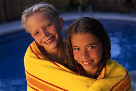 Portrait of Boy and Girl Wrapped In Towel near Swimming Pool Stock Photo - Rights-Managed, Code: 700-00066818