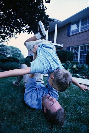 father child yard not illustration not business not vintage not 20s not 30s not 40s not 70s not 80s - Father and Son Playing Outdoors Stock Photo - Rights-Managed, Code: 700-00067024