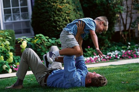 father child yard not illustration not business not vintage not 20s not 30s not 40s not 70s not 80s - Father and Son Playing Outdoors Stock Photo - Rights-Managed, Code: 700-00067025