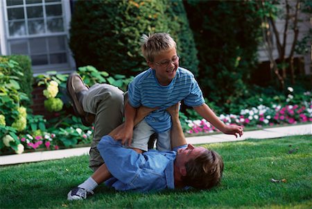 father child yard not illustration not business not vintage not 20s not 30s not 40s not 70s not 80s - Father and Son Playing Outdoors Stock Photo - Rights-Managed, Code: 700-00067027