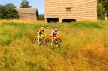 simsearch:700-00091951,k - Couple Biking through Field of Tall Grass, Maine, USA Stock Photo - Rights-Managed, Code: 700-00067082