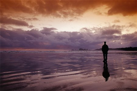 simsearch:700-03696893,k - Person Standing on Beach at Sunset, Long Beach British Columbia, Canada Stock Photo - Rights-Managed, Code: 700-00067142