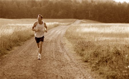 simsearch:700-00634176,k - Man Running on Dirt Road Maine, USA Stock Photo - Rights-Managed, Code: 700-00067160