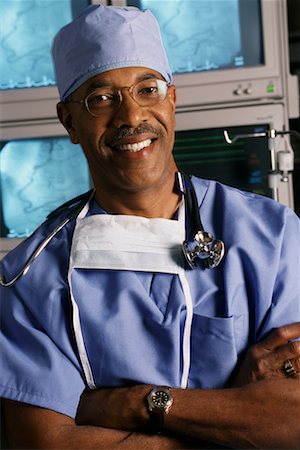 Portrait of Mature Male Doctor With Stethoscope and Mask Stock Photo - Rights-Managed, Code: 700-00067487