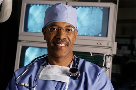 Portrait of Mature Male Doctor With Stethoscope and Mask Stock Photo - Rights-Managed, Code: 700-00067488