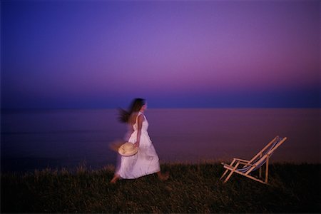 Woman and Deck Chair near Shore Cavendish, Prince Edward Island Canada Fotografie stock - Rights-Managed, Codice: 700-00067652