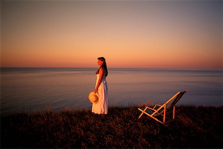 Woman and Deck Chair near Shore At Sunrise, Cavendish, Prince Edward Island, Canada Fotografie stock - Rights-Managed, Codice: 700-00067653