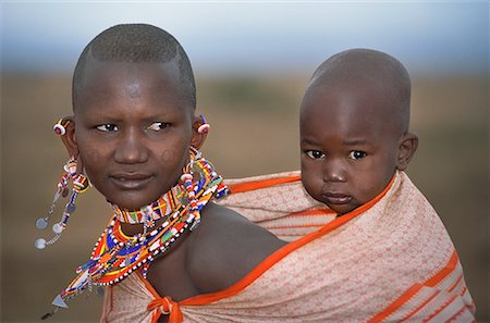Masai Mother Carrying Child on Back, Kenya, Africa Stock Photo - Rights-Managed, Code: 700-00067764