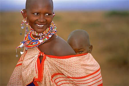 Masai Woman Carrying Child on Back, Kenya, Africa Stock Photo - Rights-Managed, Code: 700-00067765