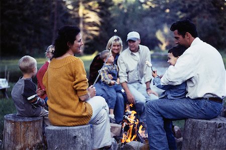 roasting marshmallows - Family Sitting by Campfire Roasting Marshmallows Stock Photo - Rights-Managed, Code: 700-00067931